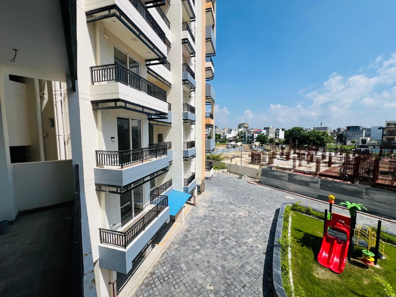 Luxury high-rise residential towers with resort swimming pool and clubhouse in Lucknow
