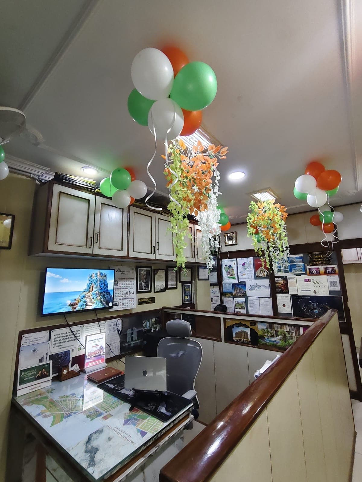 Consultation desk with Lucknow layout maps and project documentation at PROPERTYWAYS office